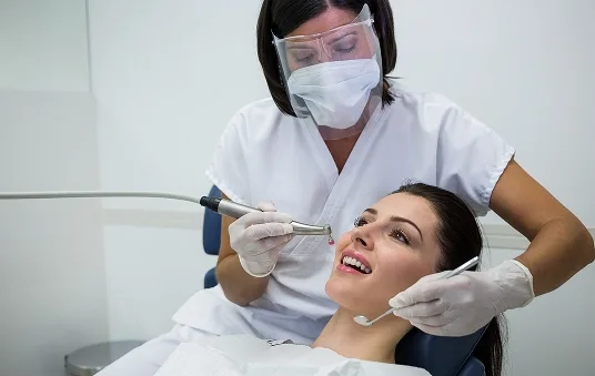 Dentist explaining treatment on a screen
